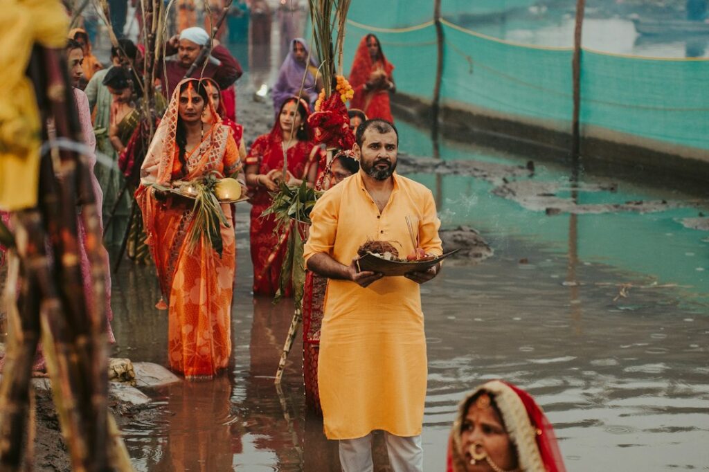 Devotees performing Tarpan ritual by the river during Pitru Paksha